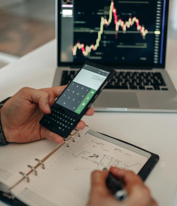 modern office workspace with financial analysts working on investment portfolio analysis