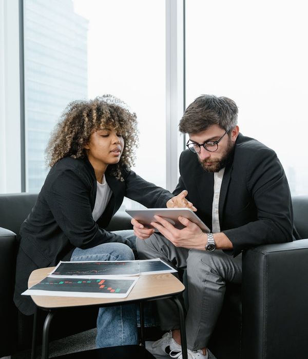 woman data analyst reviewing financial charts and performance indicators